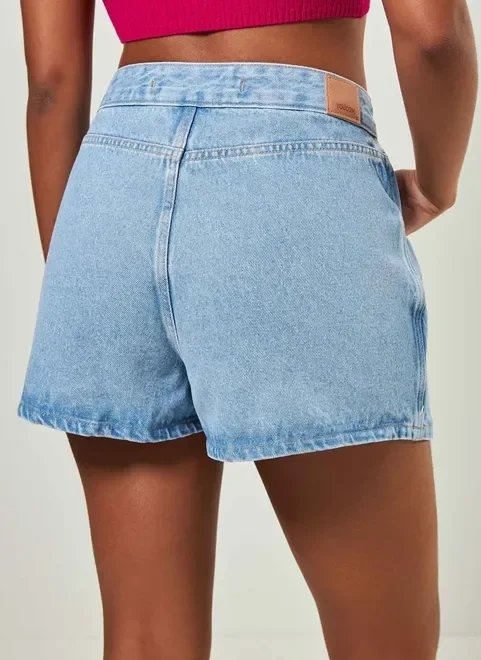 short saia jeans com botão deslocado short saia jeans com botão deslocado
