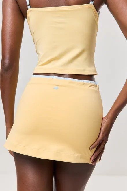 saia short amarelo manteiga athleisure saia short amarelo manteiga athleisure